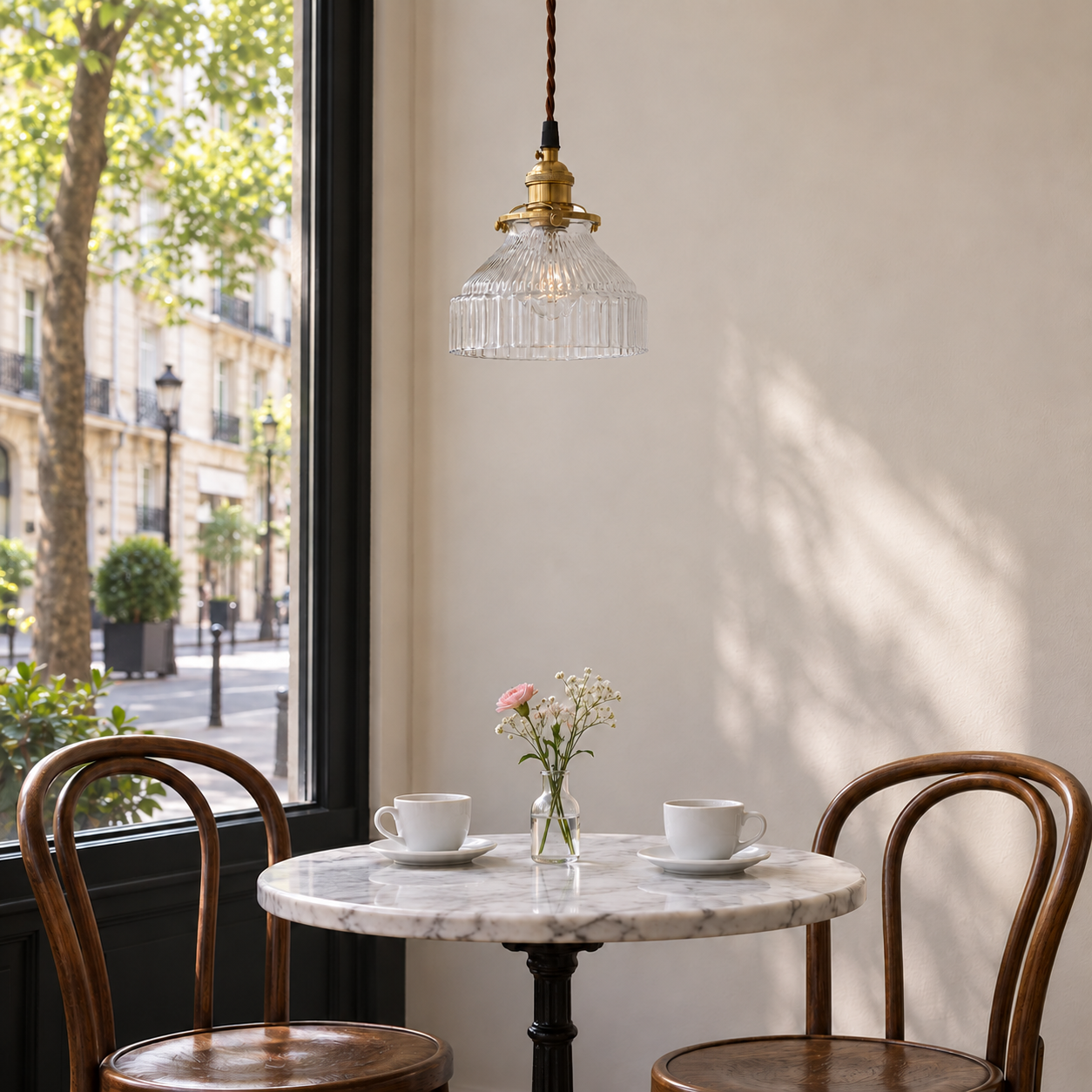 Transparent ribbed glass and brass pendant in a cafe